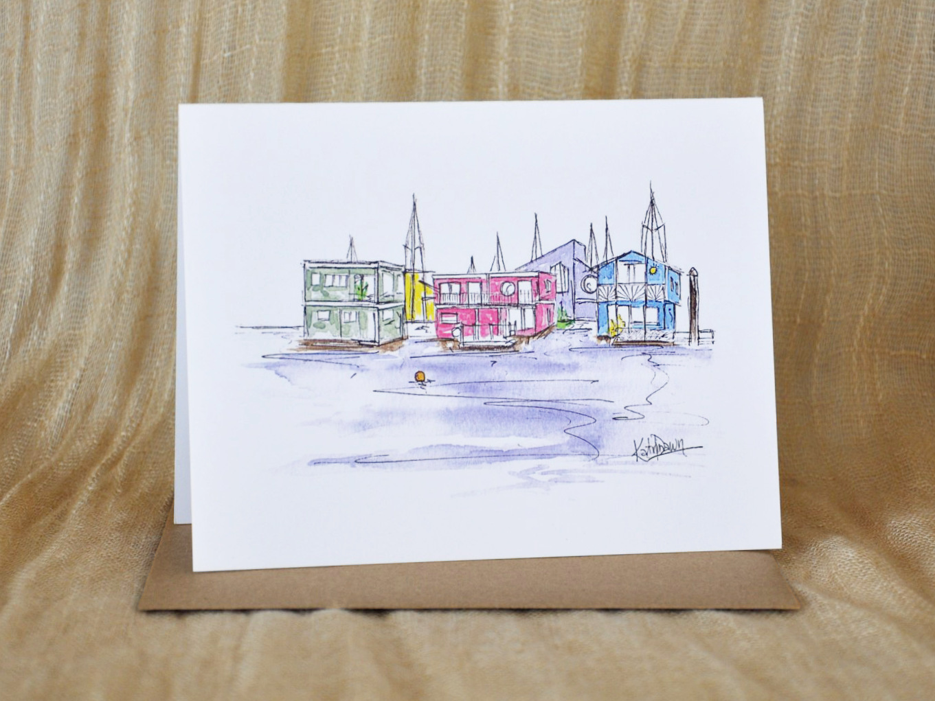 KatrinaDawn watercolour and ink sketch of Fisherman's Wharf in Victoria, BC, shown with a kraft paper envelope.