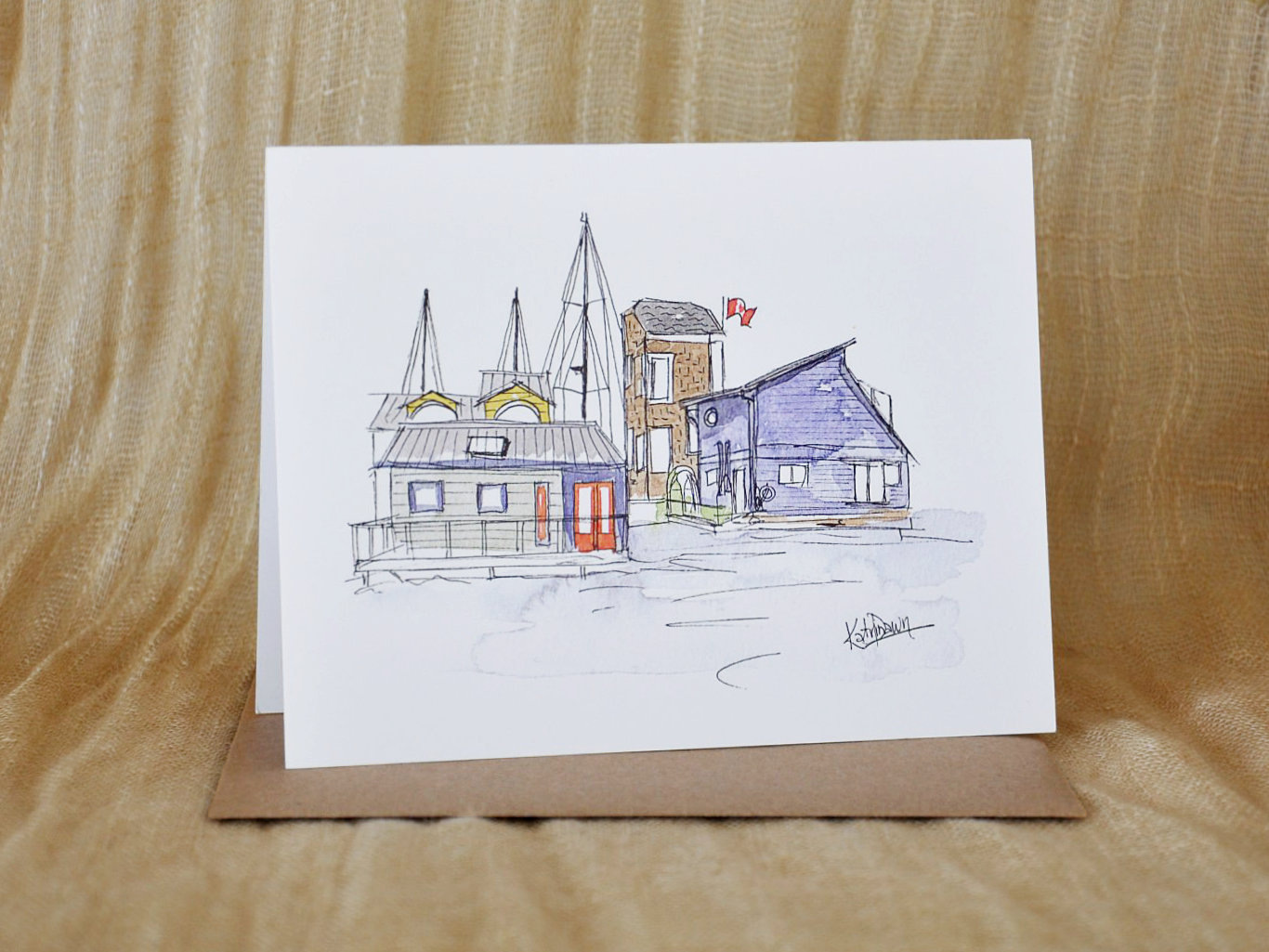 KatrinaDawn watercolour and ink sketch of Fisherman's Wharf in Victoria, BC, shown with a kraft paper envelope.