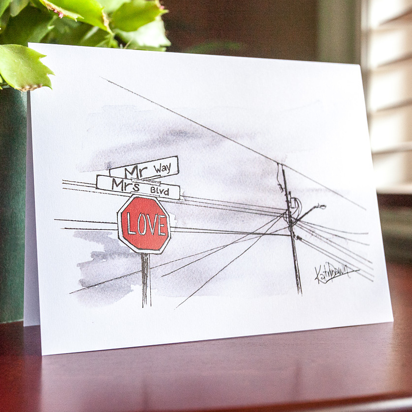 New wedding card by Katrina Dawn featuring a hand-painted watercolor of powerlines and a stopsign converted to the word LOVE; Mr Way and Mrs Blvd are the cross streets.
