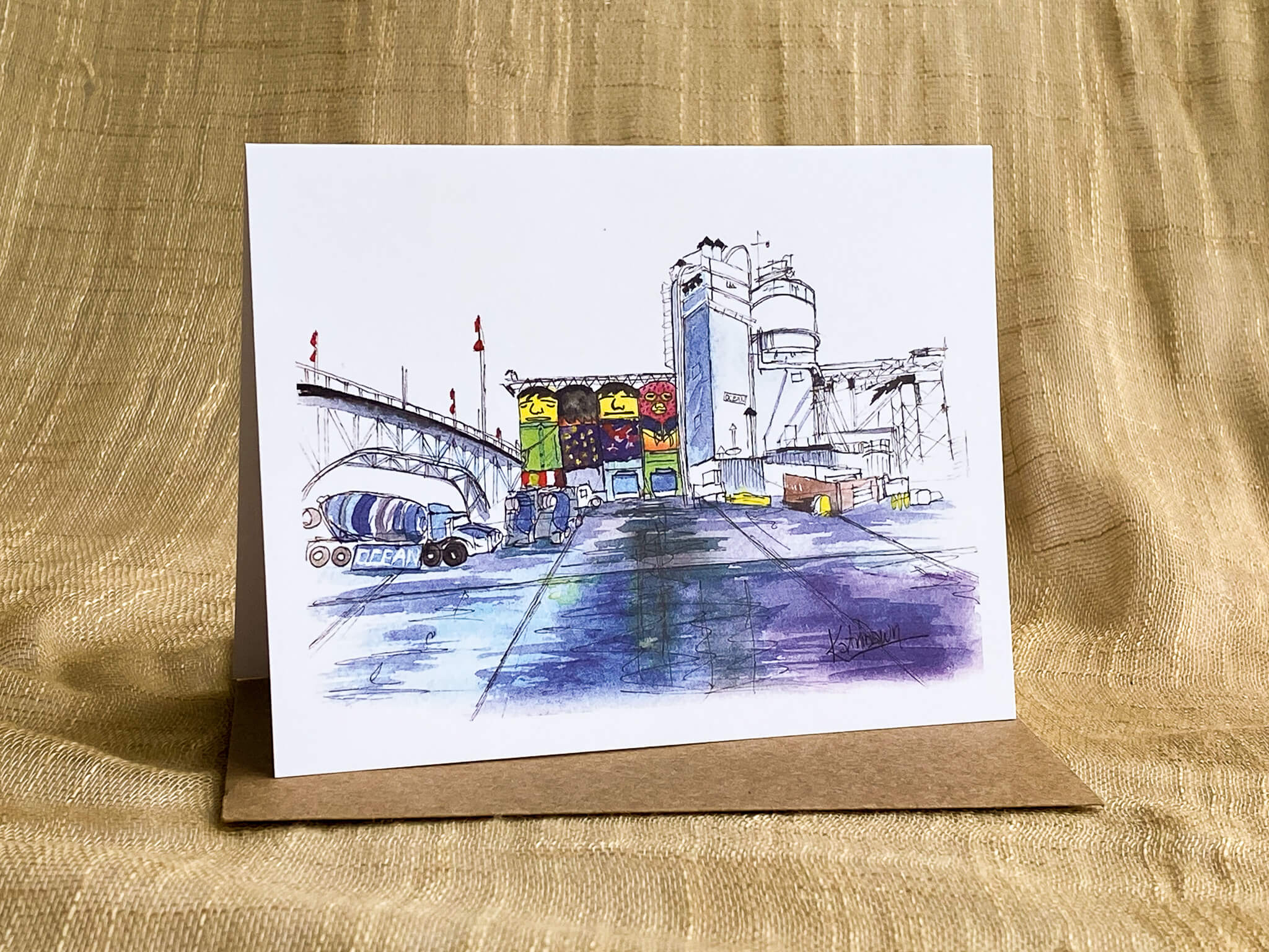 Watercolor and ink greeting card by Katrina Dawn of industrial grain silos painted with colorful murals as seen at Granville Island, shown with a kraft paper envelope