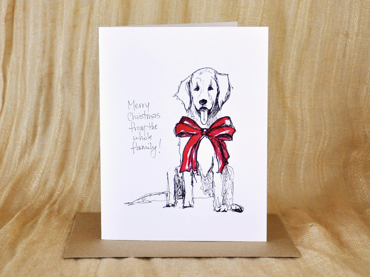 KatrinaDawn pen and ink Christmas card featuring a dog in a red bow, shown with a kraft paper envelope